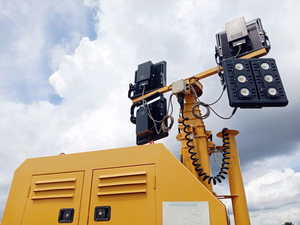 An Orange Generator is Sitting on Top of a Lush Green Field — Chaffey Power in West Mackay, QLD