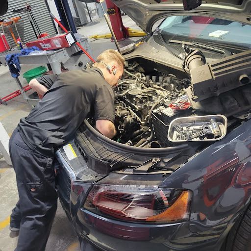 Zach repairing car