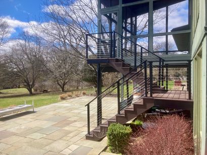 There are stairs leading up to the second floor of a house.