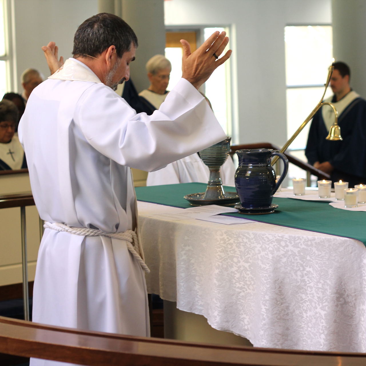 Pastor Steve Murphy offering communion at Aldersgate United Methodist Church in north Durham