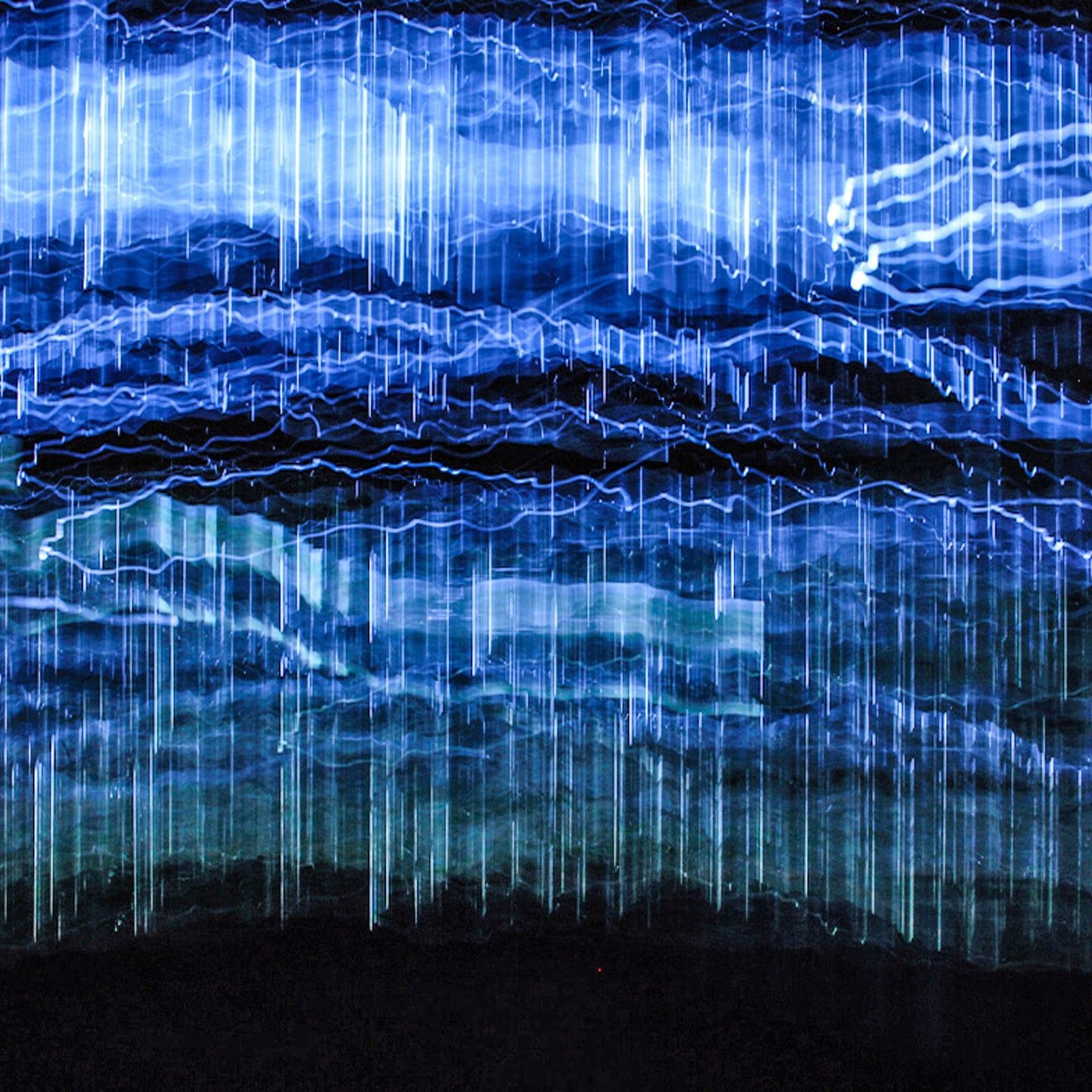 A blue and black background with a lot of lines