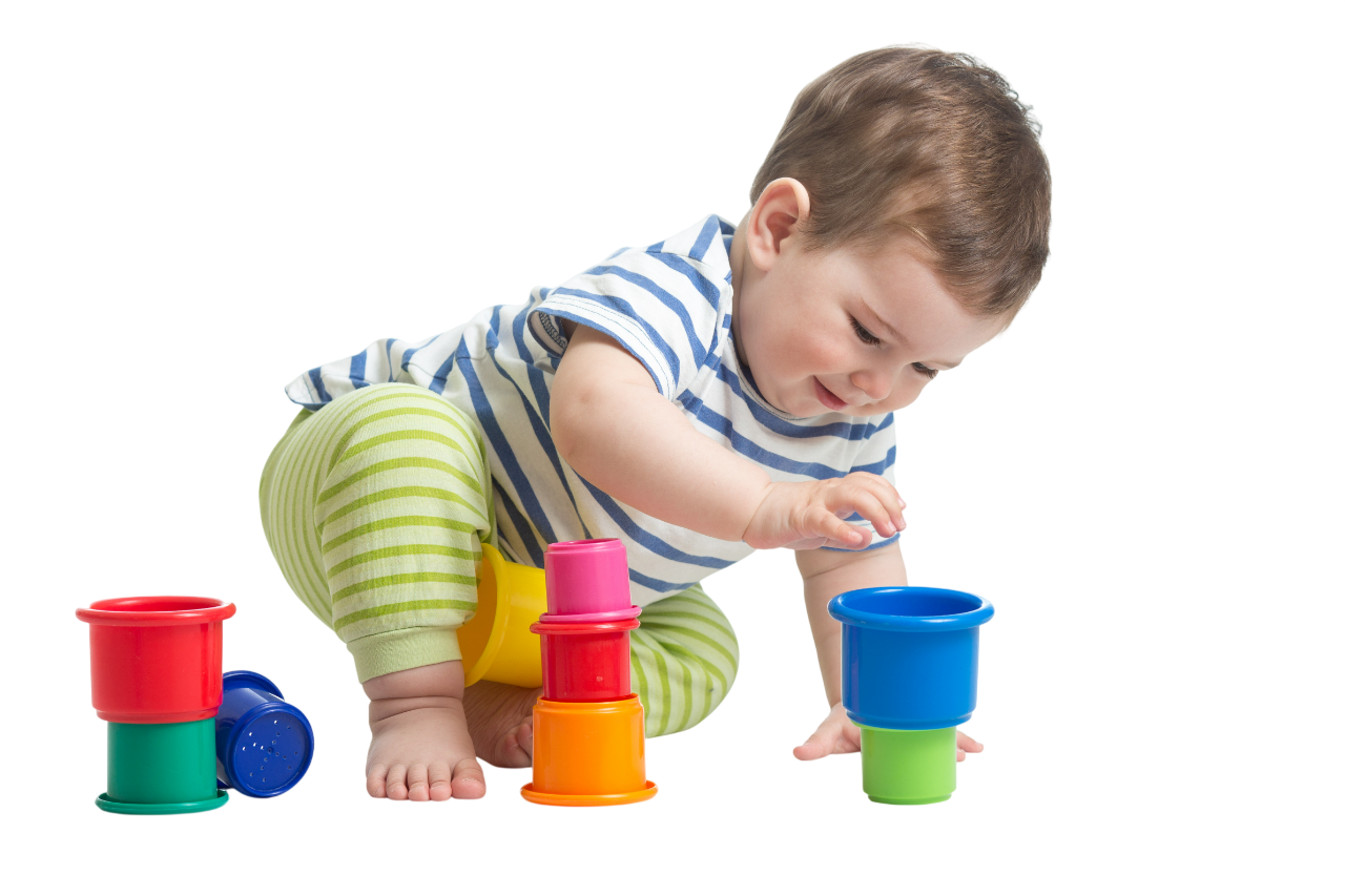 Two young children hugging and laughing with closed eyes.