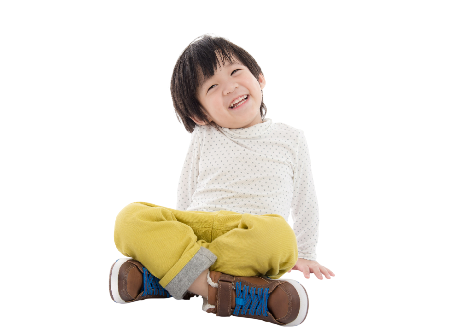 Young child with blonde hair wearing a plaid shirt, laughing with mouth wide open.