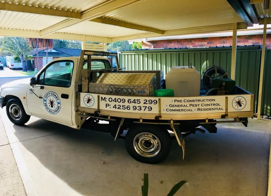 A Work Ute Is Parked In A Garage — City Coast Pest Solutions In Wollongong, NSW