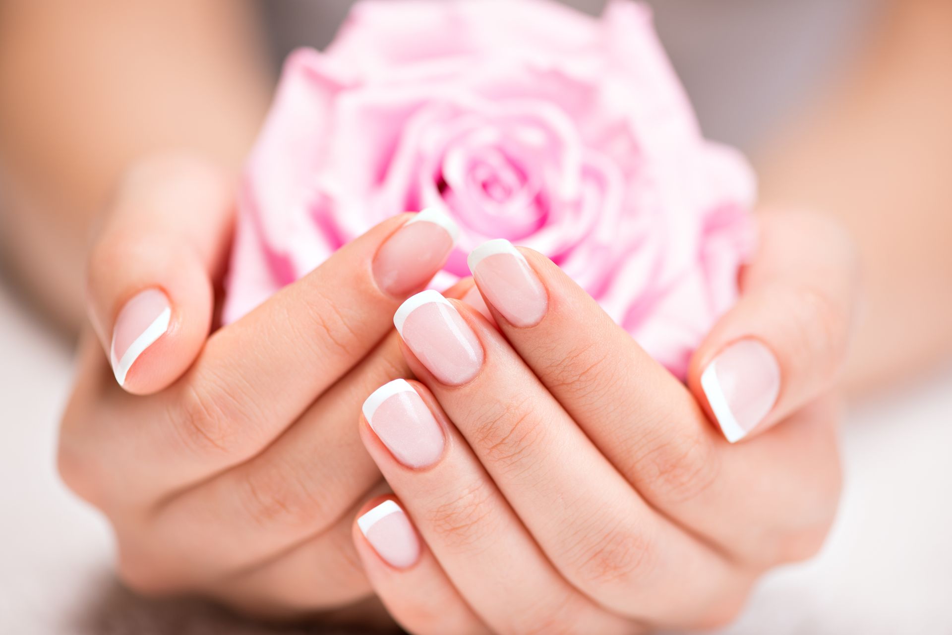 A close up of a French manicure