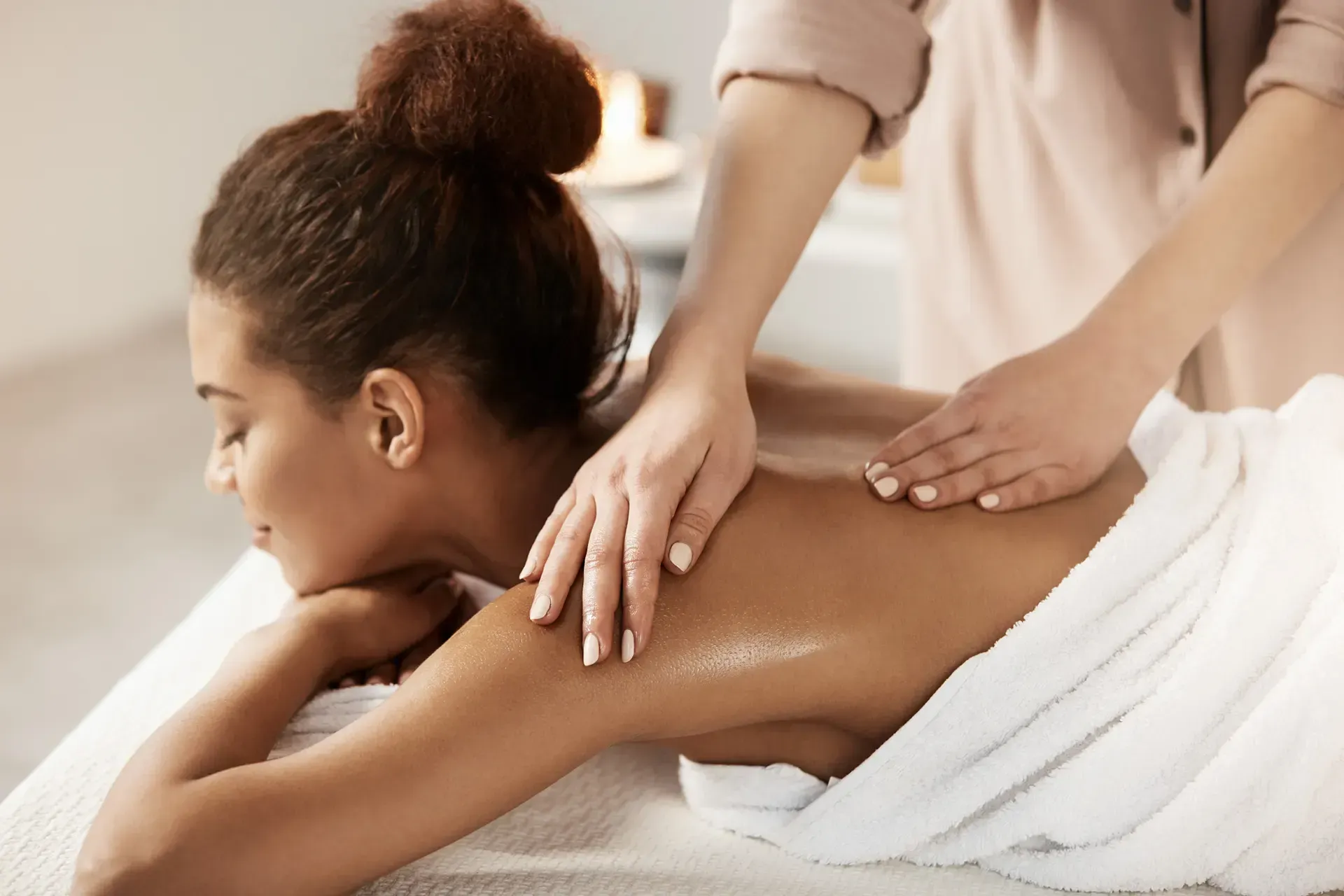 A woman is getting a massage at a spa.