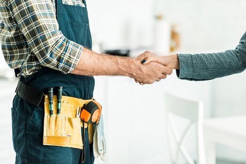 Backflow — Plumber and Client Shaking Hands in Mesquite, TX