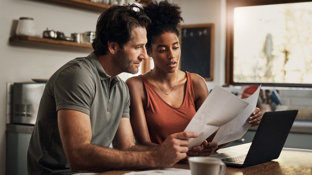 Couple Looking At Papers — Sarasota, FL — Insurance Service of Sarasota, Inc.