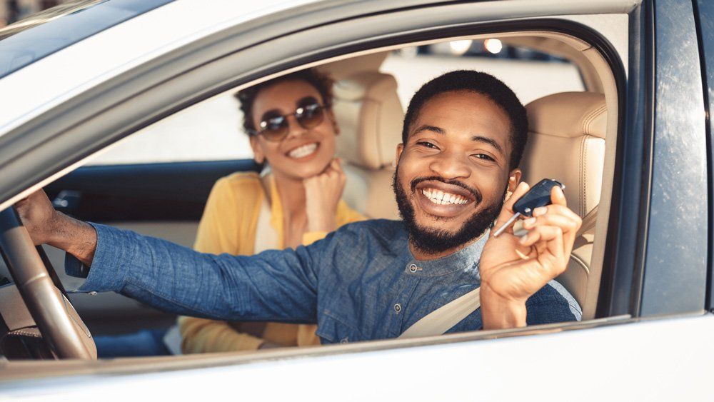 Happy Couple Having New Car — Sarasota, FL — Insurance Service of Sarasota, Inc.