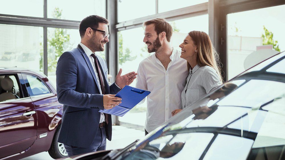 Couple Getting A New Car — Sarasota, FL — Insurance Service of Sarasota, Inc.