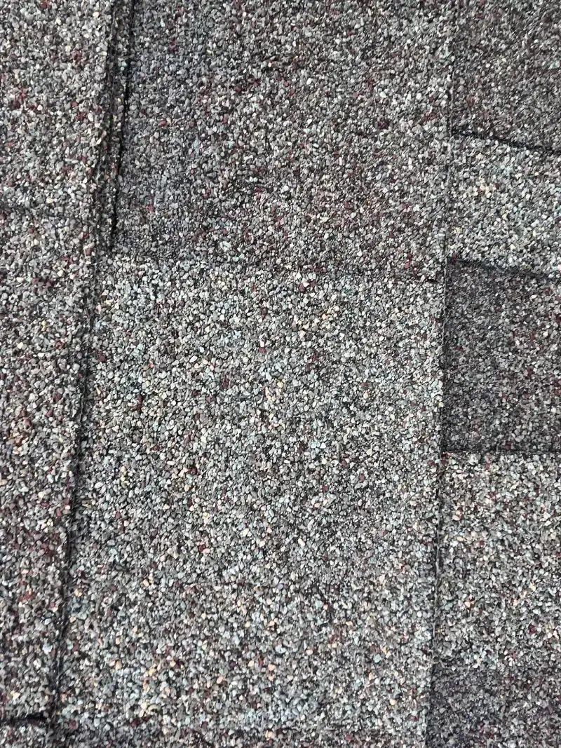 Gray and brown tiled surface with visible seams.