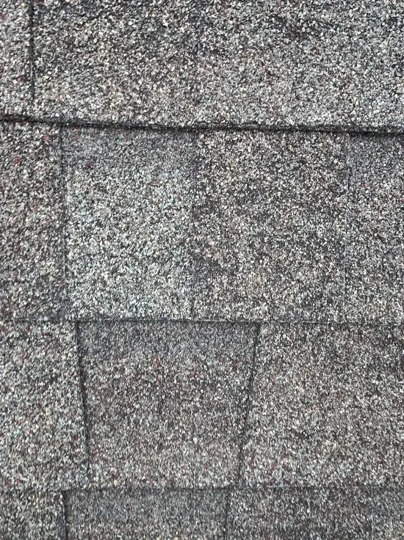 Gray asphalt roof shingles.