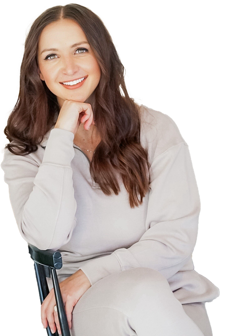 A woman is holding a black ball in her hands and smiling. Forever Fit - Personalised Workouts and Nutrition - Terrina Brewer