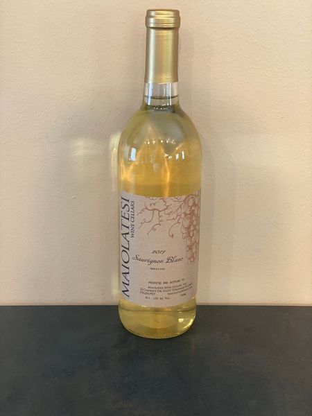 A bottle of africanatesi wine is sitting on a table