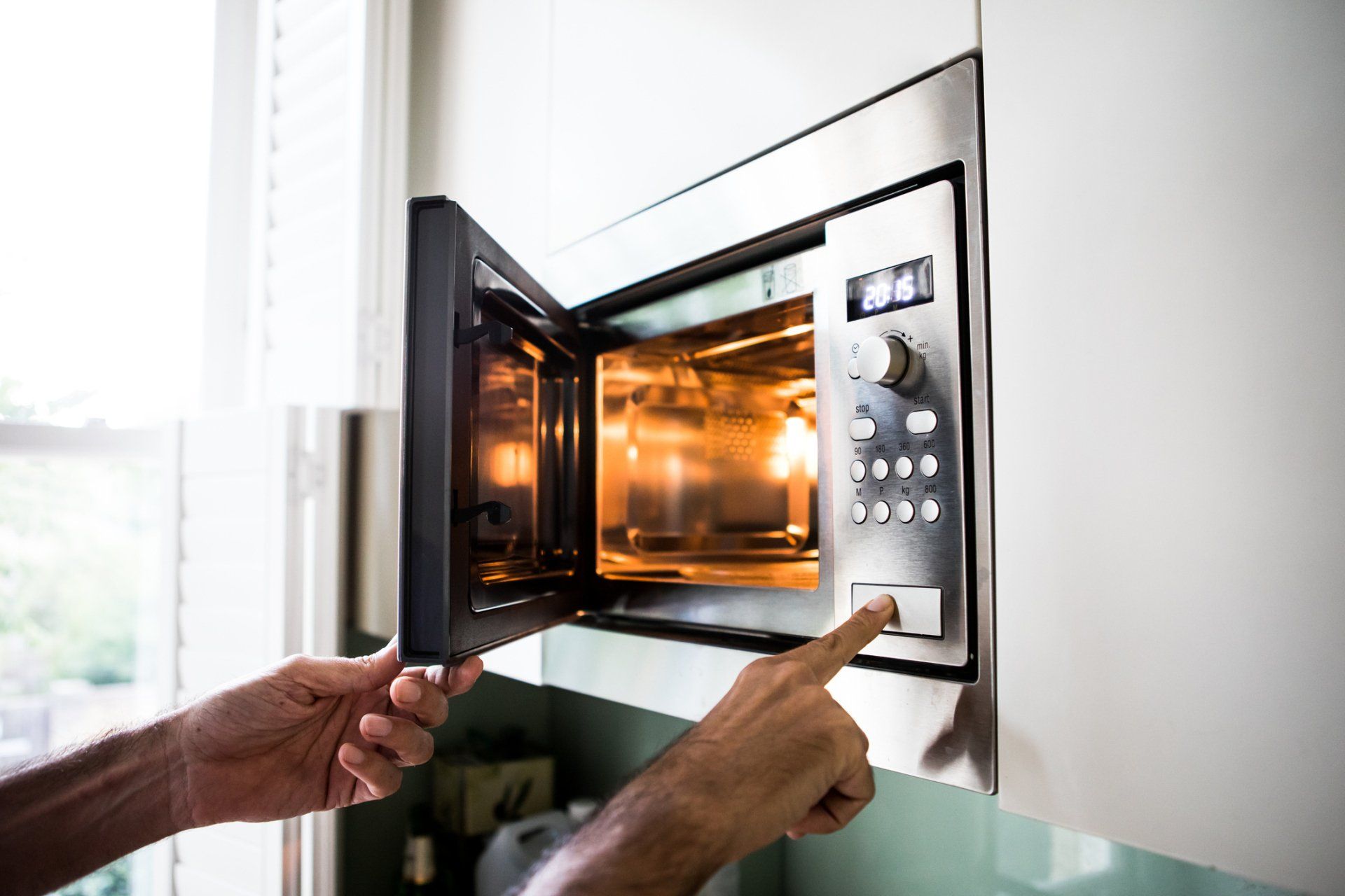 Person Using Microwave — Utica, MI — Doc's Appliance Service