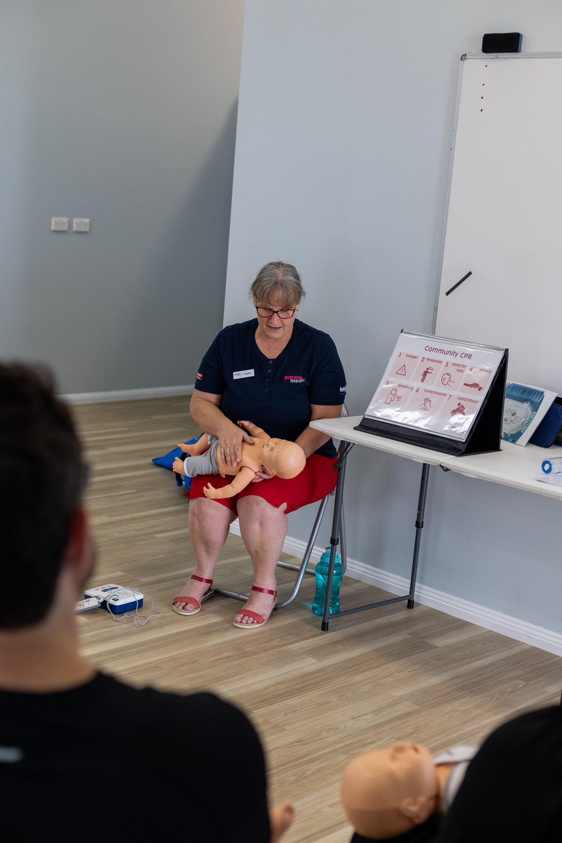 Educator with baby manikin