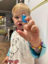 covering a child's scraped knee with a dressing