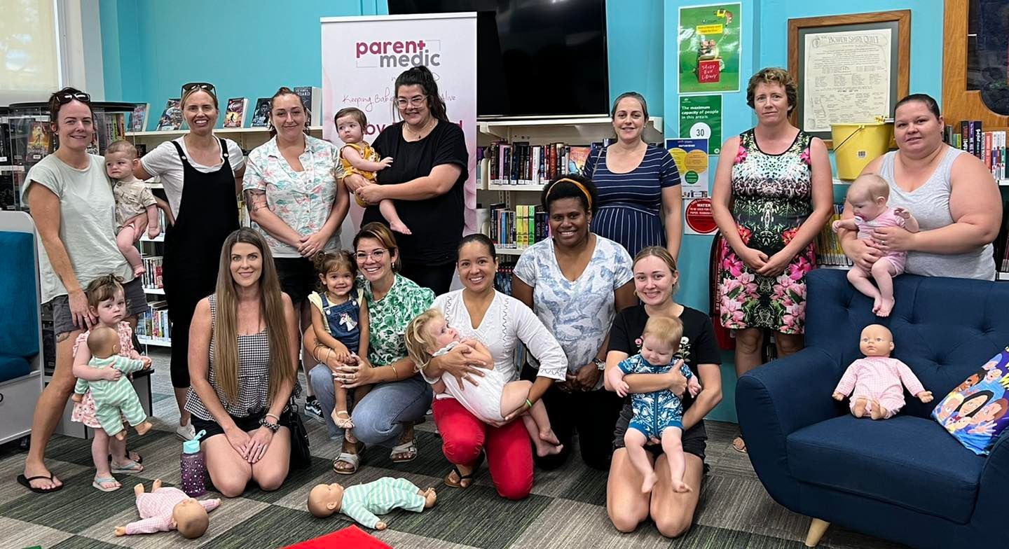 group of adults with babies and children