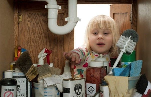 Child searching in poison cupboard