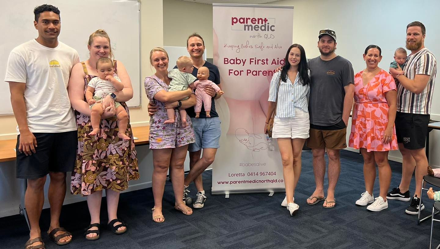 Adults holding cpr manikins