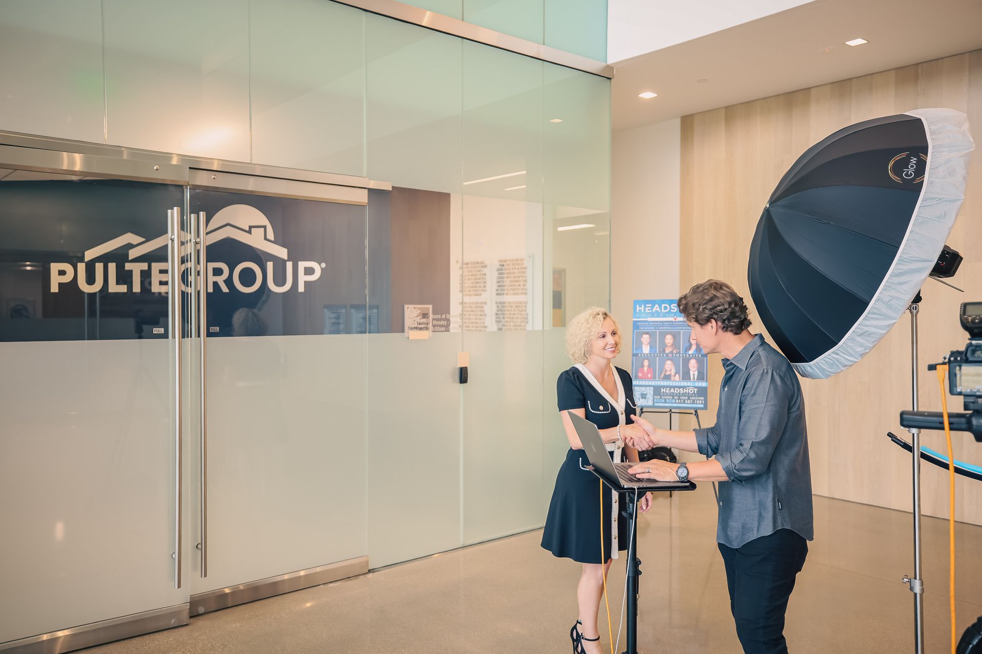 A man and a woman are standing in front of a building.