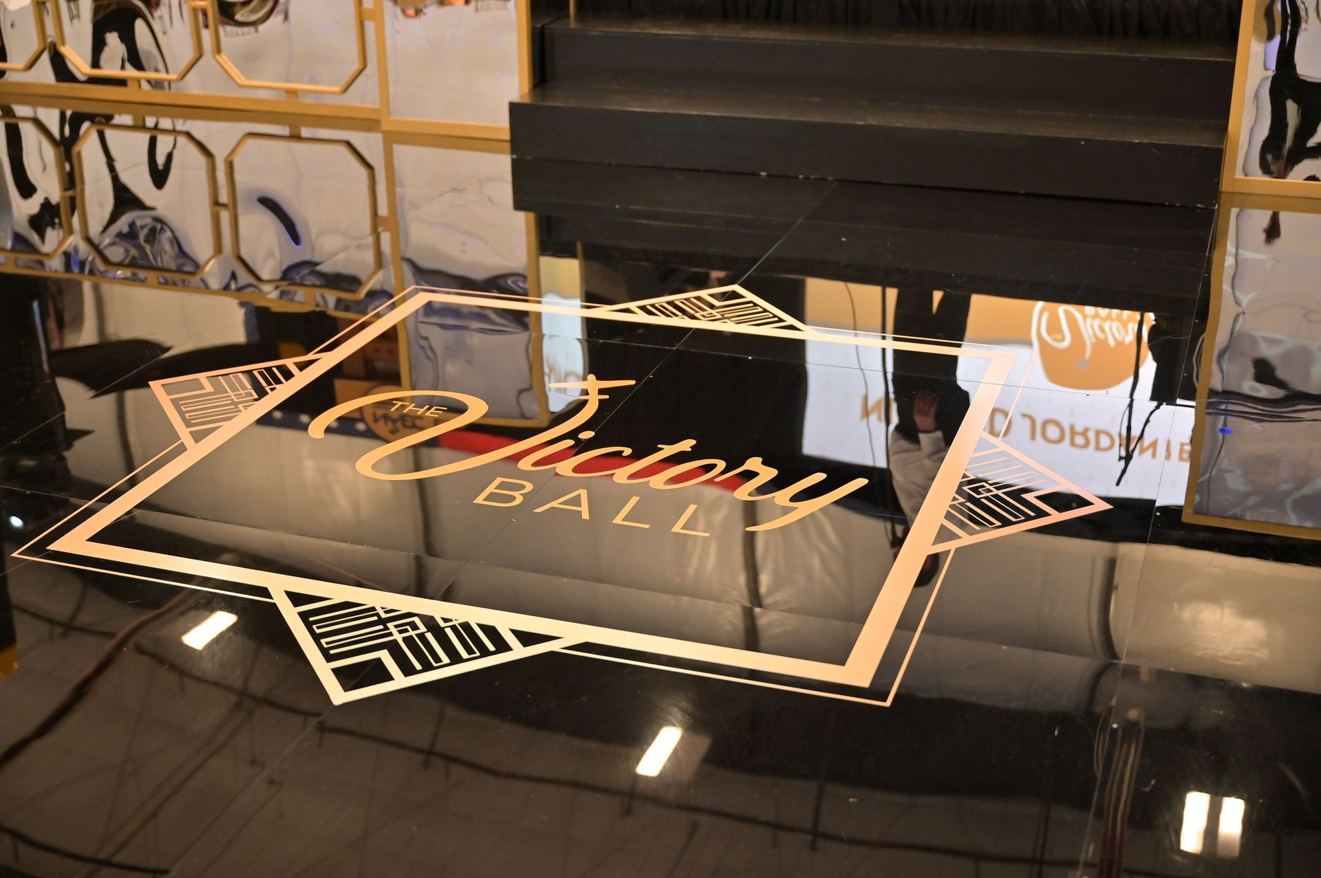 A victory ball logo is on the floor of a room