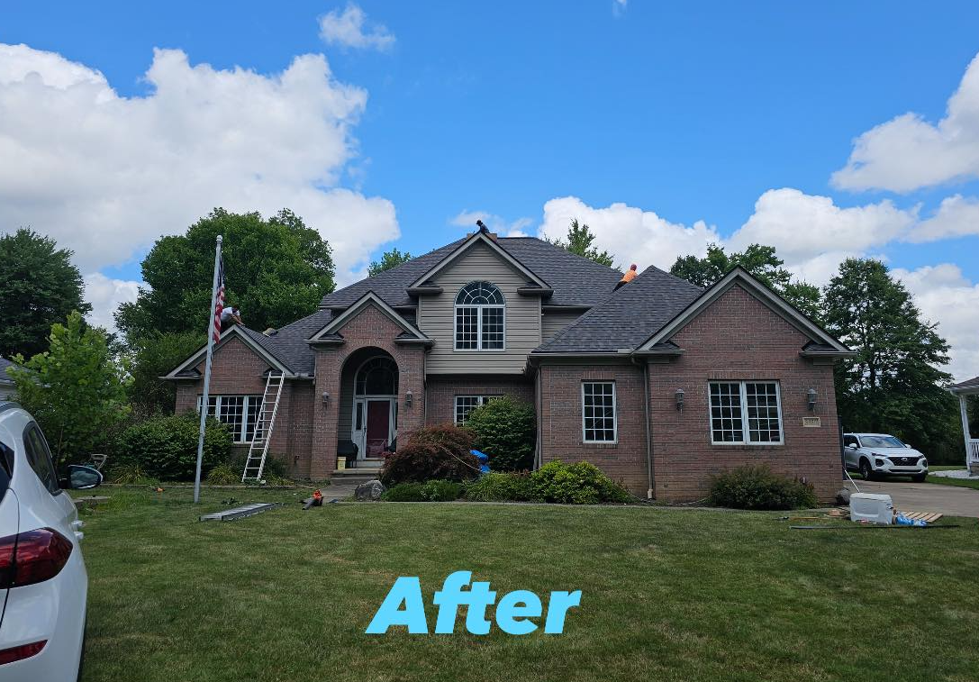 A large brick house with a car parked in front of it.