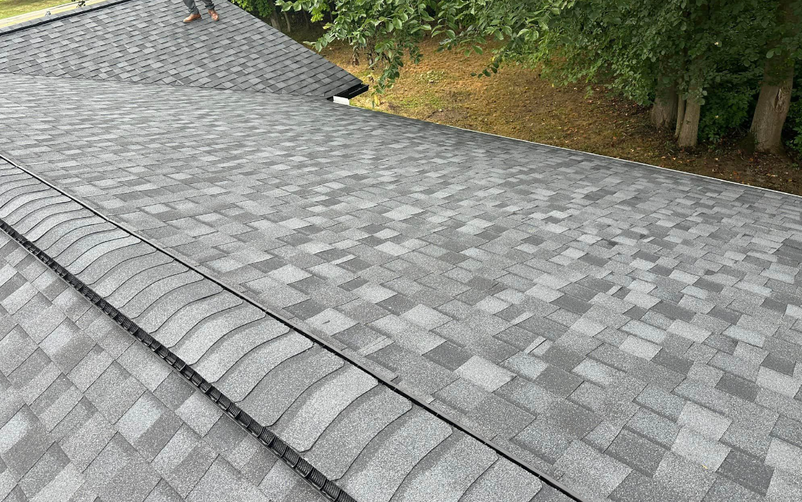 A close up of a roof with a lot of shingles on it.