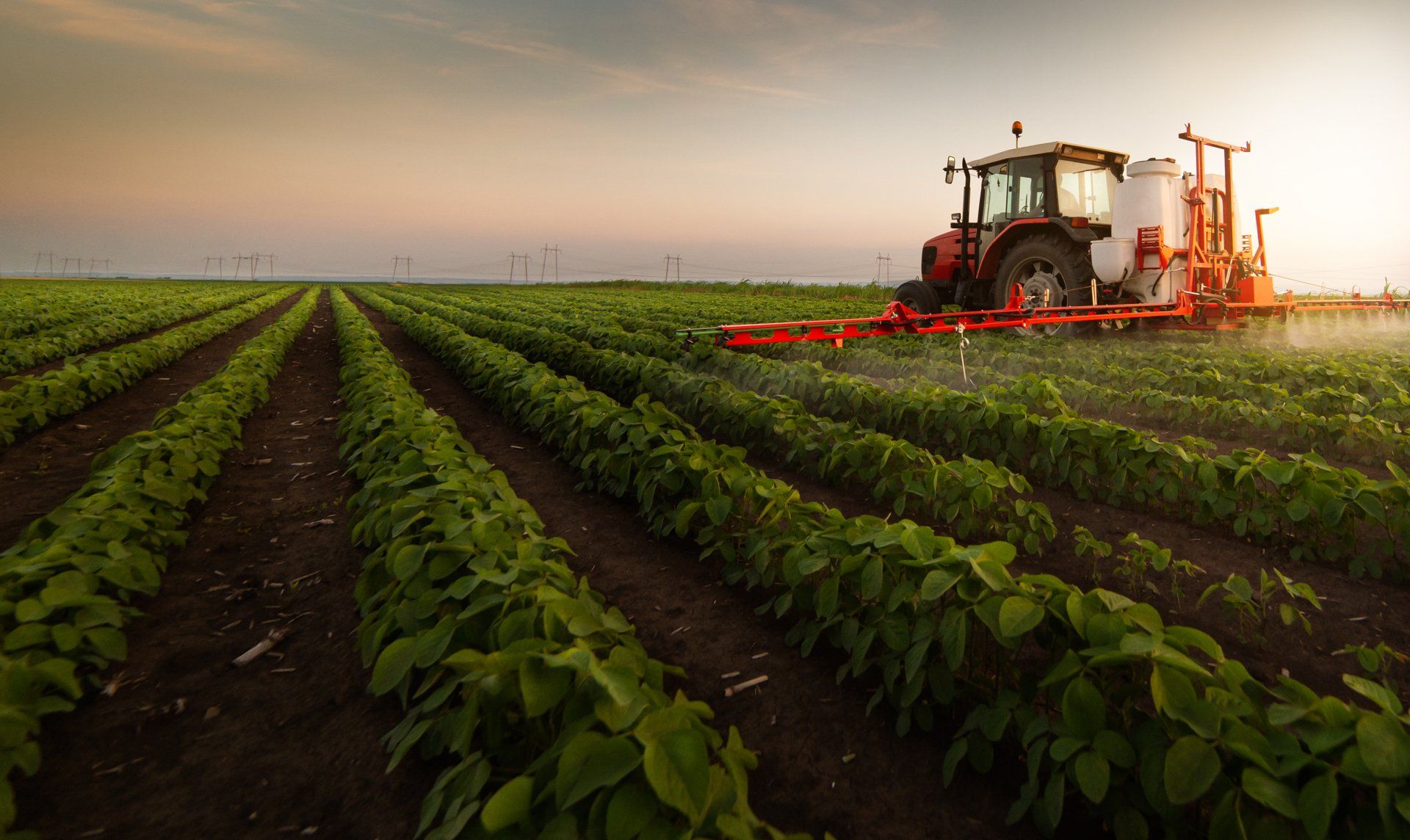 Tractor Spraying Pesticides on Field — Zanesville, OH — Hamilton, Waltman, Obenour, Melsheimer & Assoc., LLC