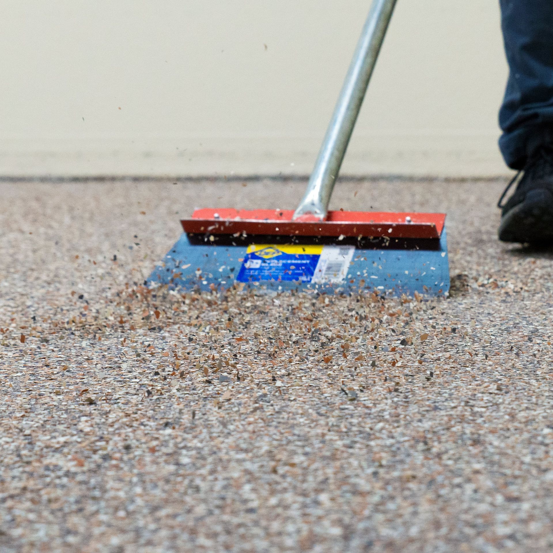 outdoor garage floor being cleaned