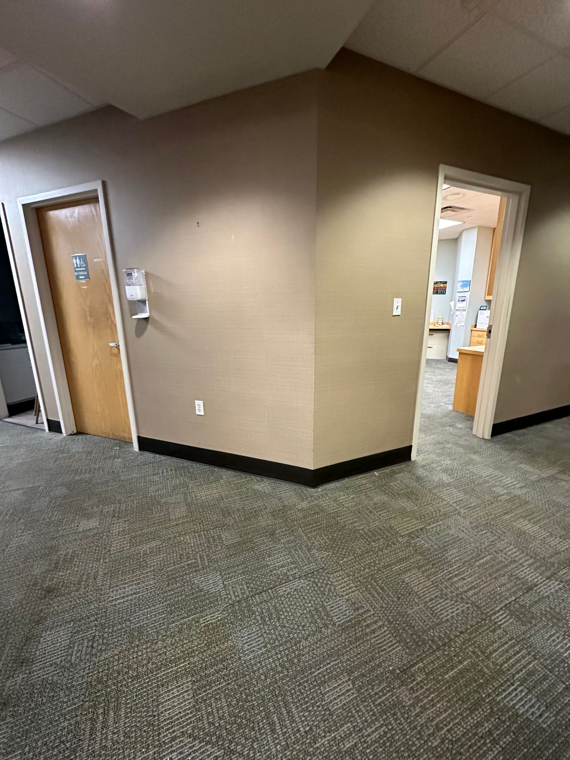 A man is plastering a wall with a spatula.