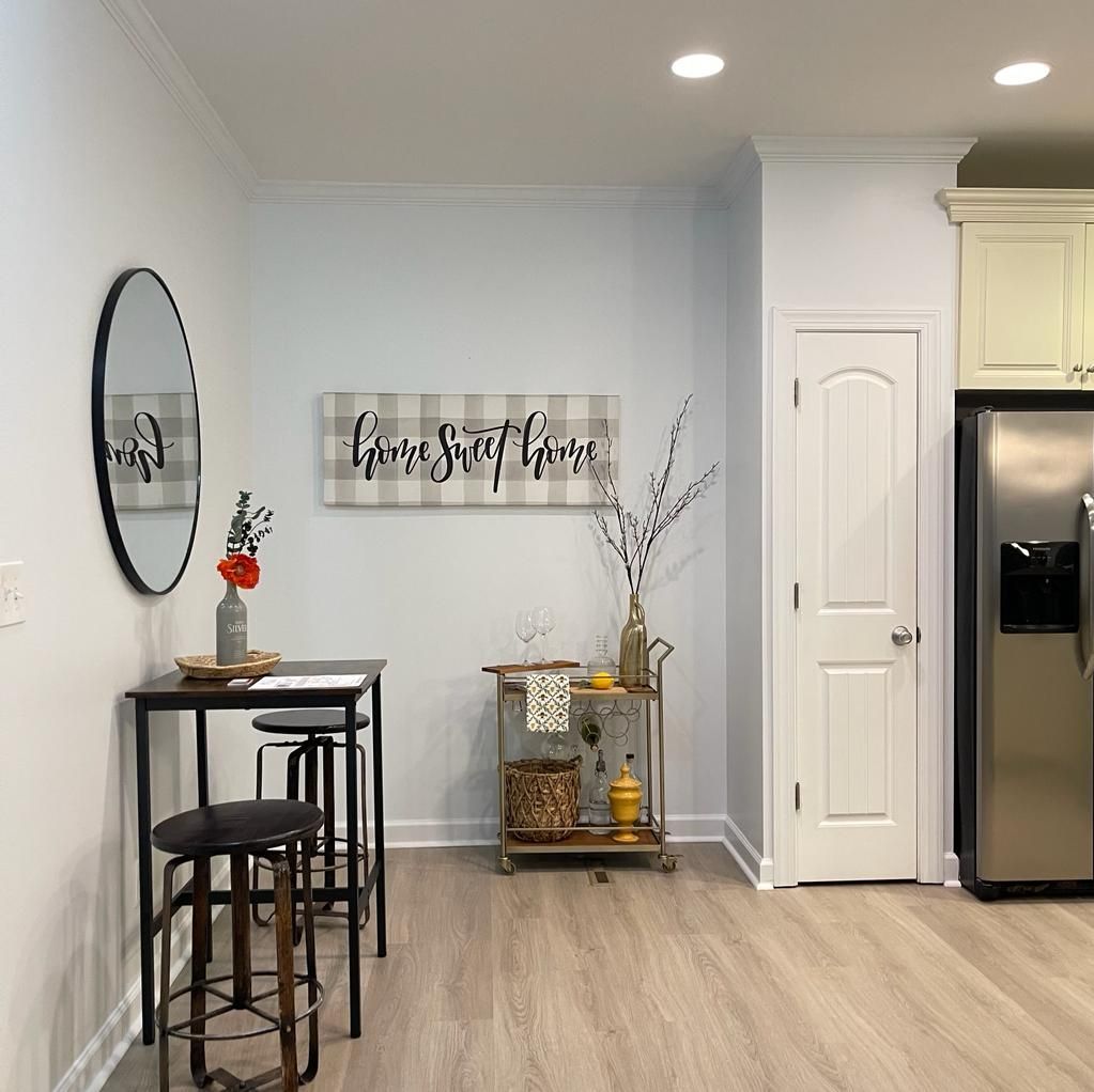 A man is painting a wall with a brush.