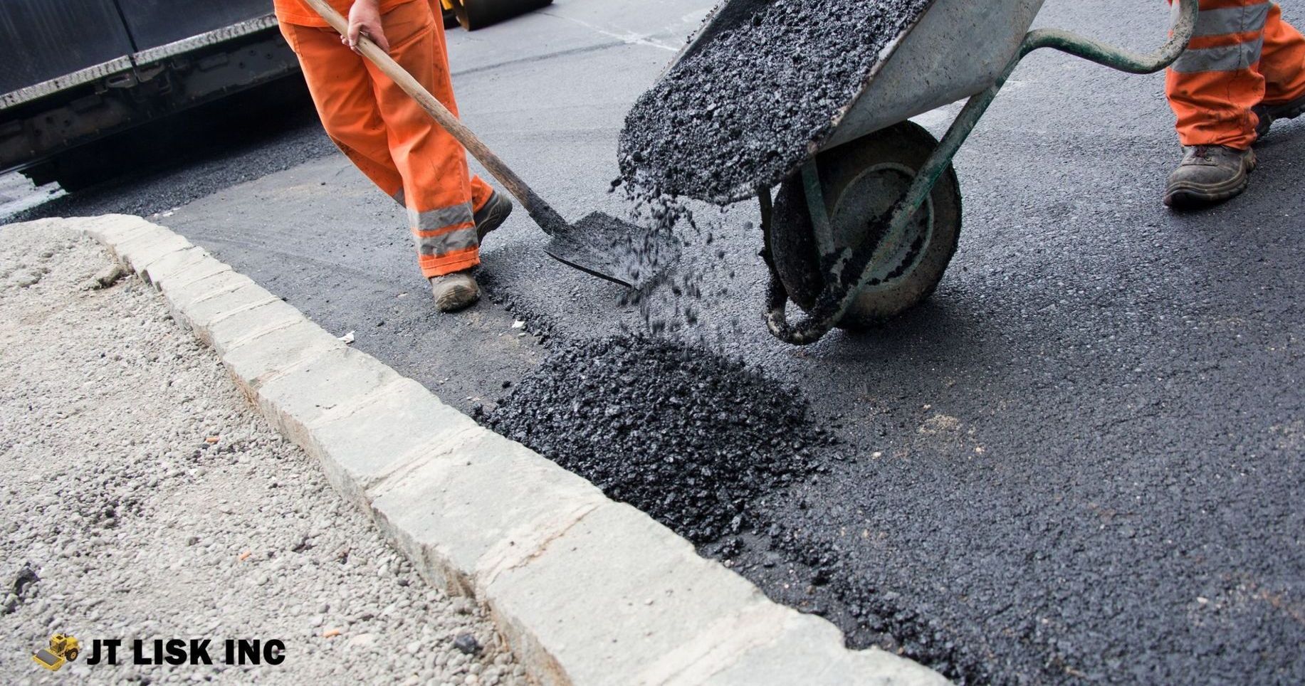 Contractor applying asphalt to roadbed in Albemarle