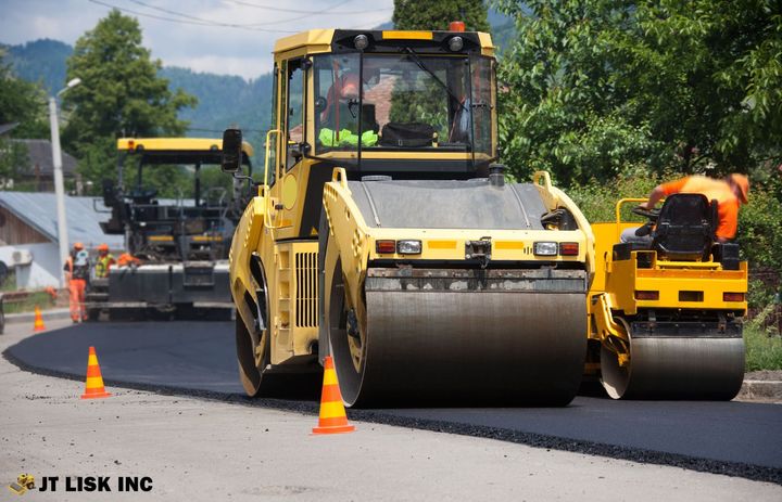 Asphalt roller smoothing new road surface in Albemarle