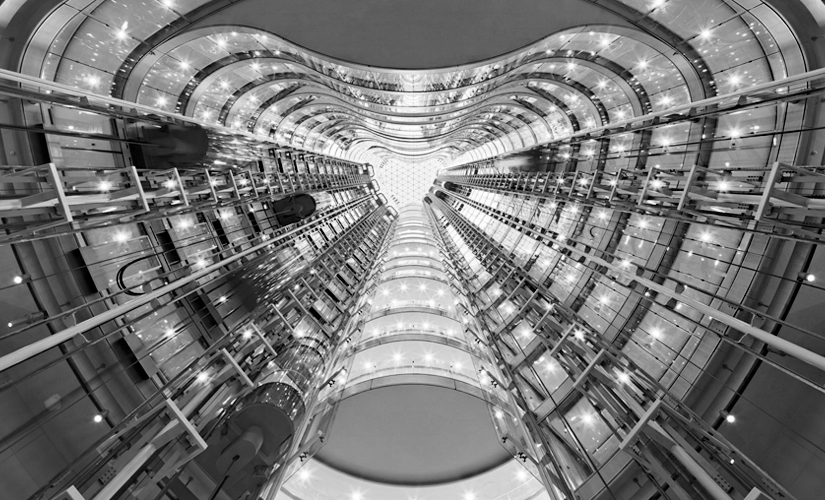 It is a black and white photo of a very tall building.