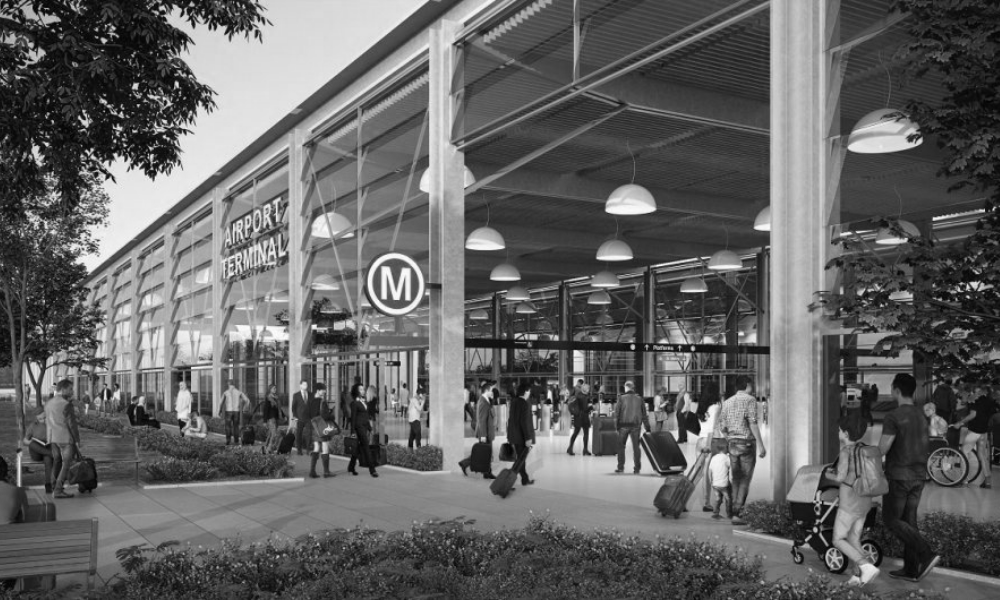 A black and white photo of a building with a sign that says m on it.