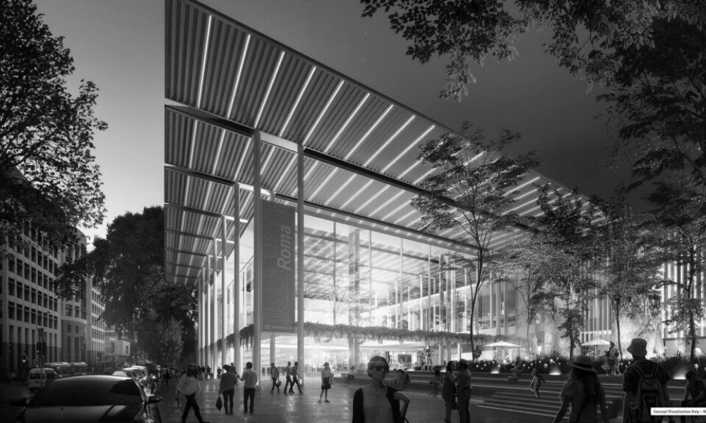 A black and white photo of people walking in front of a large building.