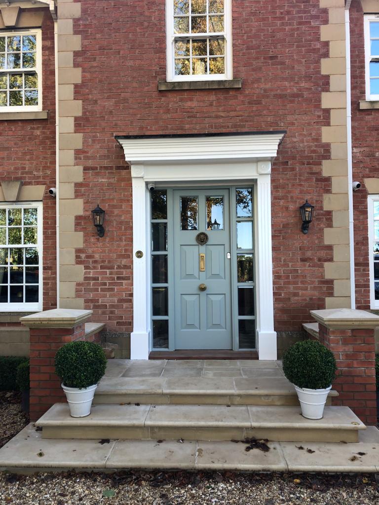 This is a picture of a front door which has had green exterior paint as the main colour.  This picture was taken by one of the team at Painters and decorators Leicester