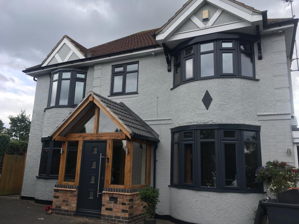 This is an external picture of a house that has been painted in a white exterior paint by Painters Leicester