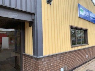 This is a picture of the outside of a warehouse that has been painted using external paint by Painter and decorator Leicester