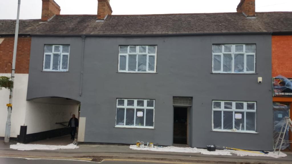 This is a picture of a house that has had render repairs and has had external grey paint done to freshen it up. This was taken by Painters and decorators Leicester
