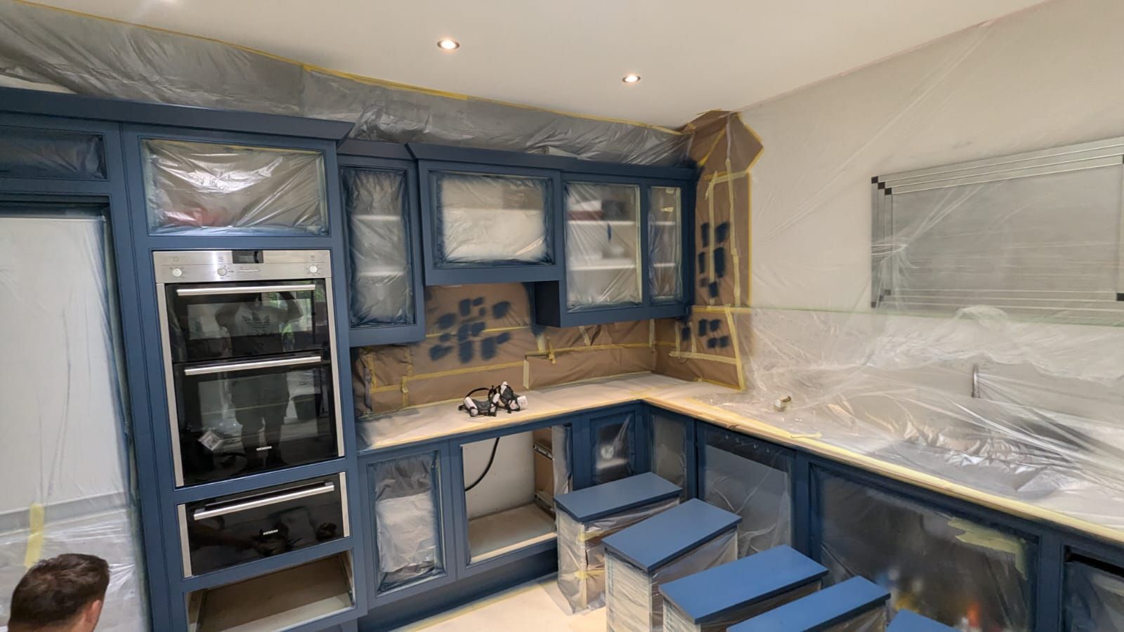 Preparing the kitchen cabinets for spray painting in Leicester