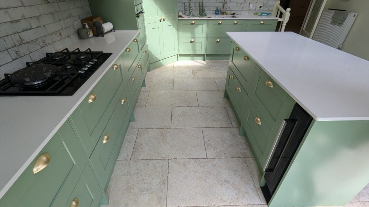 Spray painting with a green finish by decorators Leicester