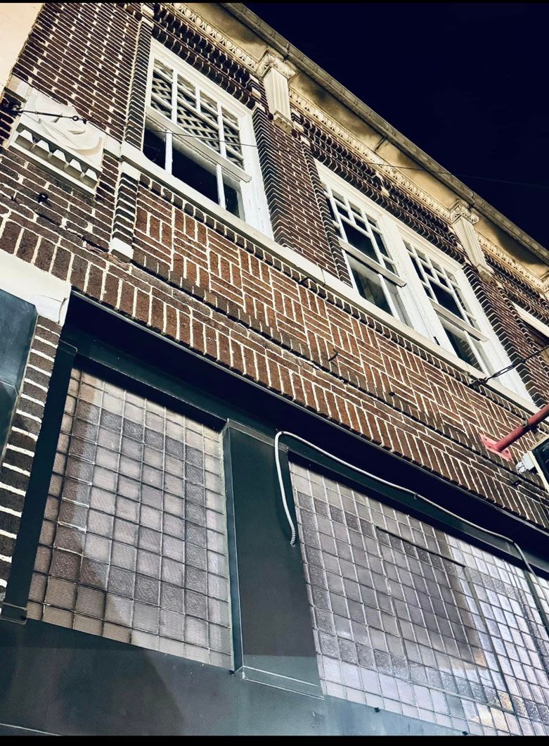 Looking up at a brick building with a lot of windows