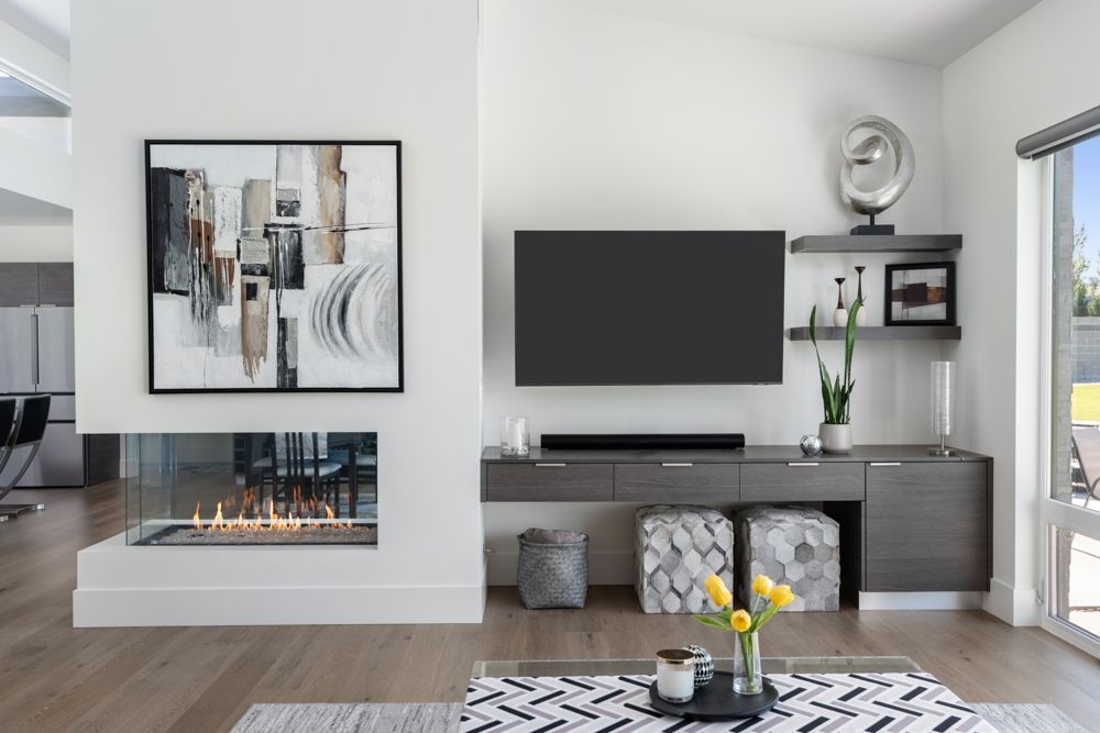 A living room with a fireplace and a flat screen tv.