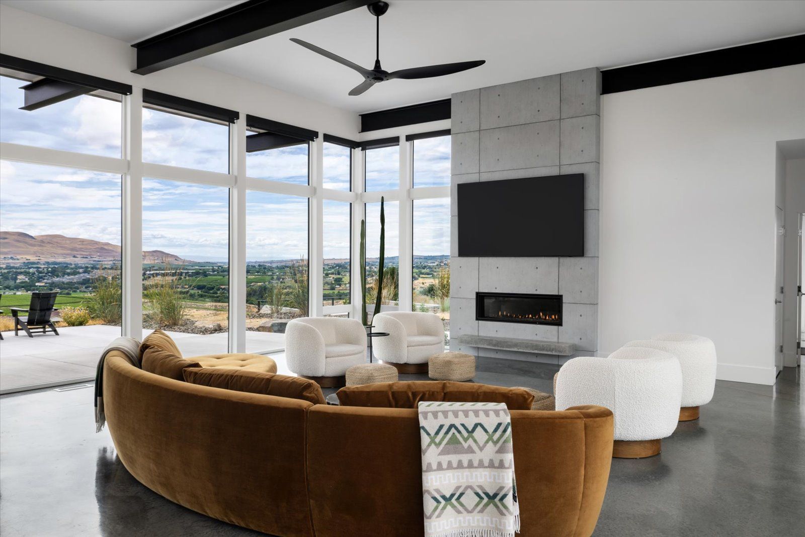 An artist 's impression of a kitchen and dining room with a round table and chairs.