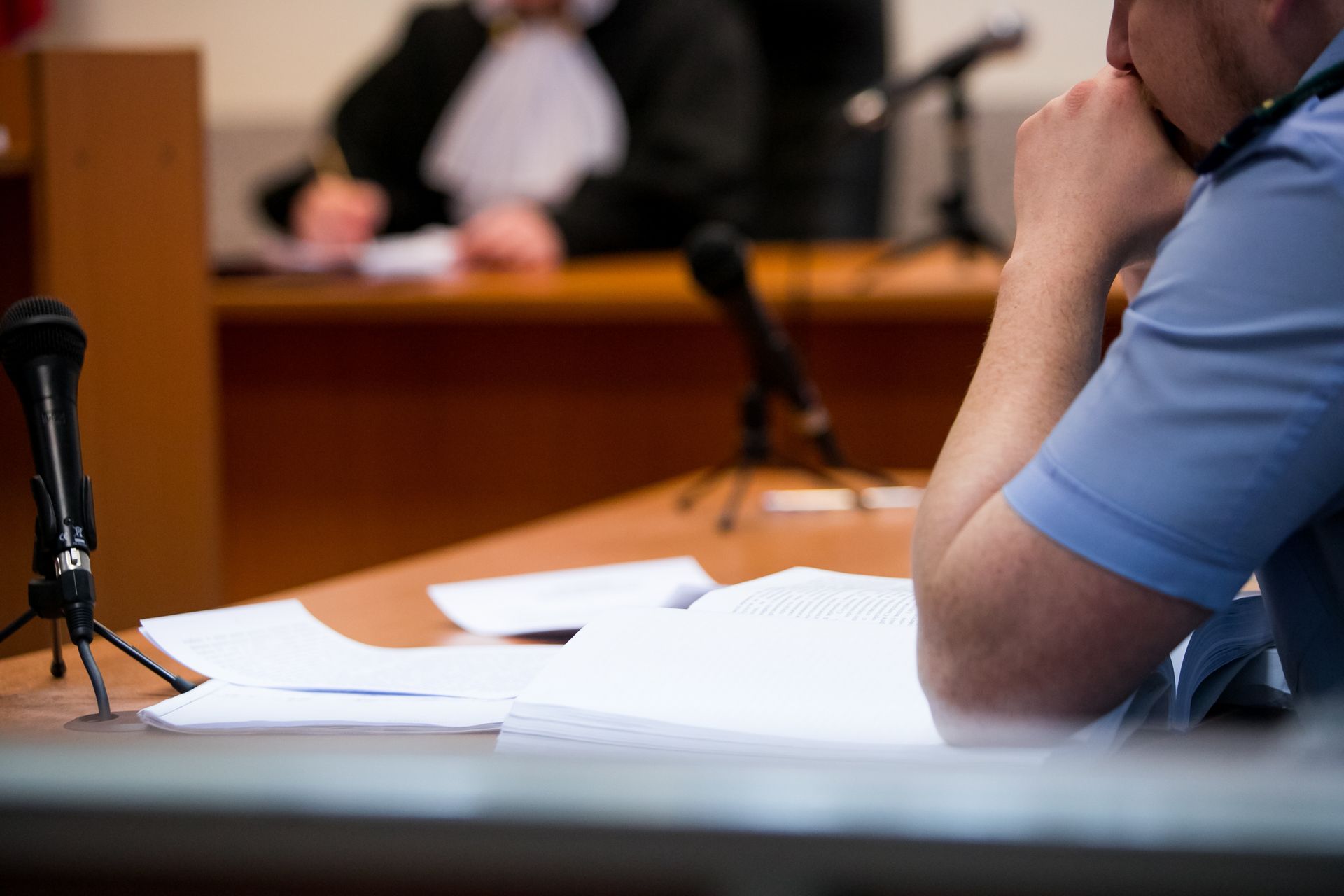 Lawyers listening to the judge in the court room. Lawyers listening to the judge in the court room.