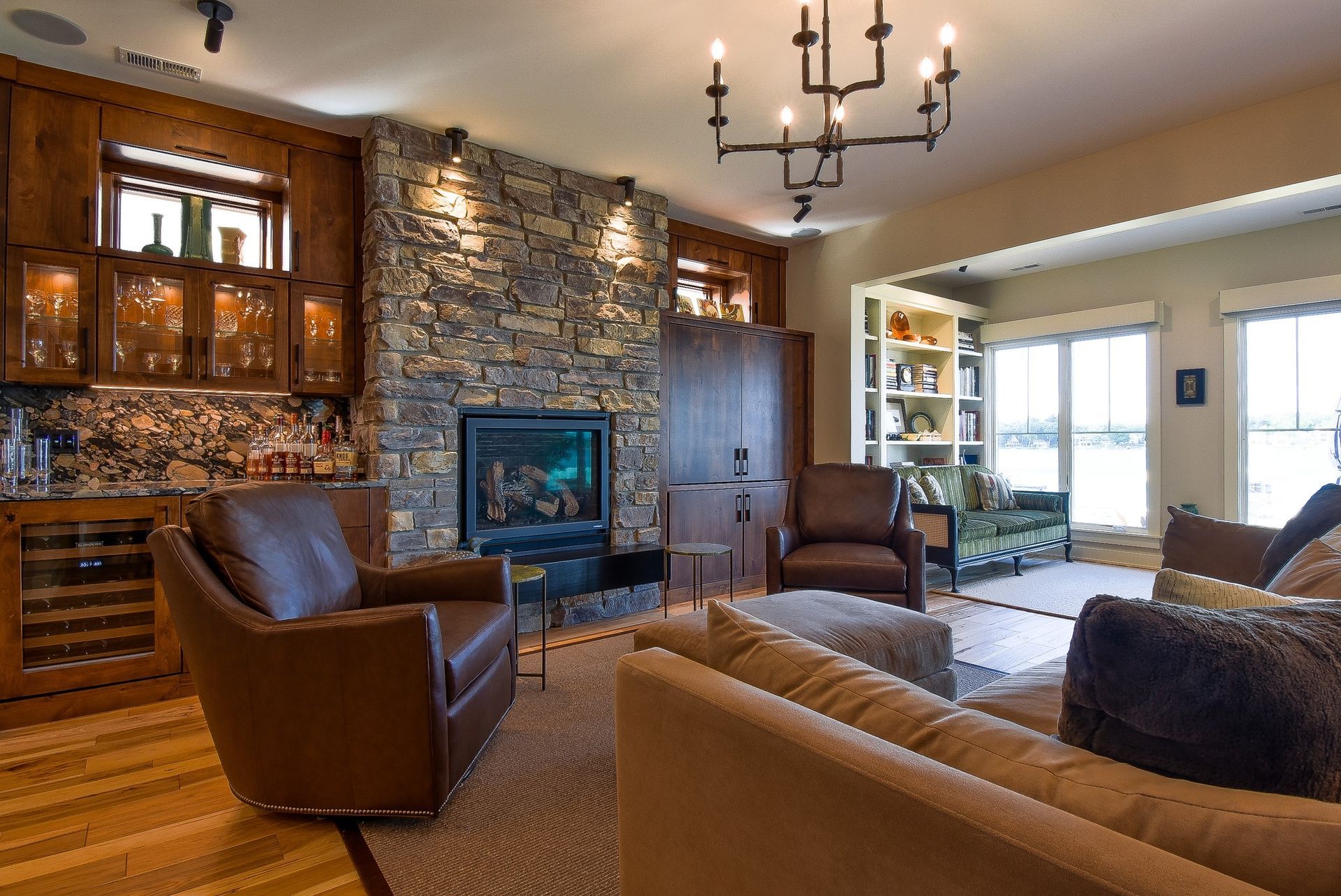 Interior space under construction with exposed walls, ceiling beams, and wiring.