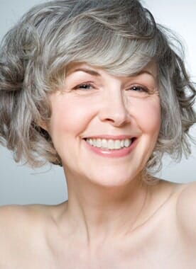 Portrait of a Smiling Senior Woman — Denture Services in Vancouver, WA