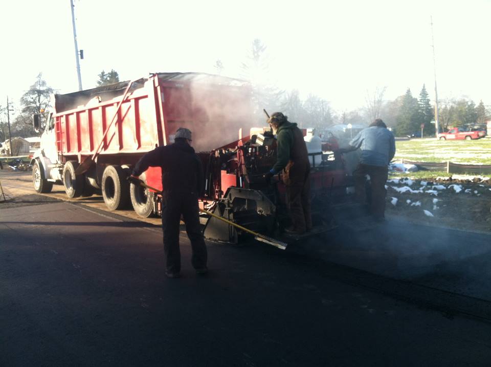 Trusted  Asphalt Paving Services — Road While Asphalt Is Being Paved in Saginaw, MI